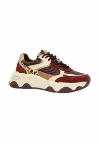 Chunky sneakers featuring red, brown, and tan panels in suede and mesh. The sole is thick and textured, displaying a contrasting dark bottom.