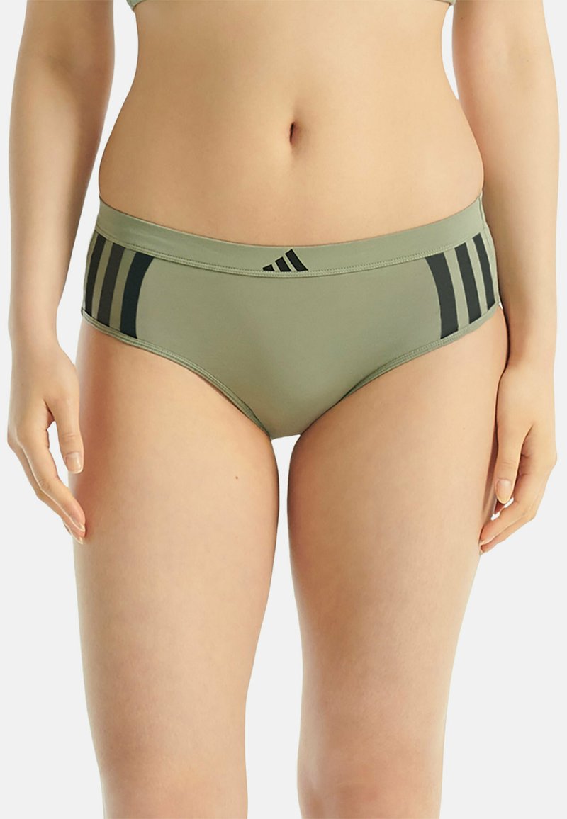 Culotte pour femmes couleur vert olive avec accents rayés noirs. Fabriquée en tissu lisse avec une coupe taille basse et une ceinture élastique.