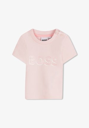 T-shirt en coton rose avec des manches courtes, un col rond et un logo "BOSS" brodé contrasté à l'avant. Deux boutons à l'épaule.