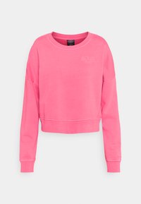 Roza skrajšani sweatshirt z dolgimi rokavi, rebrastim vratnim izrezom in manšetami. Ima vezeno logotip na sprednji strani, izdelan iz mehke tkanine.