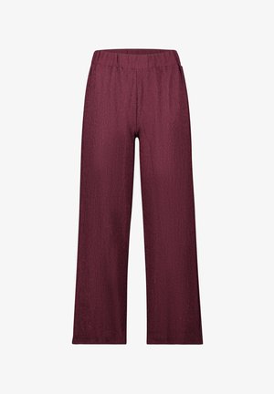 Pantalons larges en bordeaux. Fabriqués en tissu texturé avec une taille élastique. Longueur complète avec une coupe décontractée.