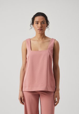 Light pink square-neck tank top with wide straps, made of soft fabric, featuring a relaxed fit and smooth texture. Paired with matching pants.