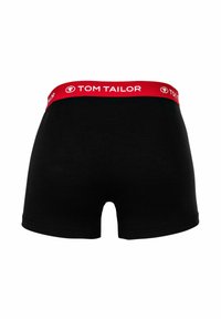 Boxer in tessuto nero con vita rossa decorata con il logo "TOM TAILOR". Il tessuto appare liscio ed elastico. Design classico corto.