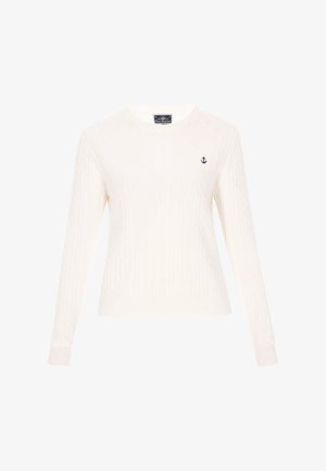 Balts ādas adījuma svārks ar garām piedurknēm un ribotām aprocēm. Uz kreisā krūškurvja ir neliela tumši zilā enkura emblēma. Mīksta tekstūra, apaļā kakla izgriezums.