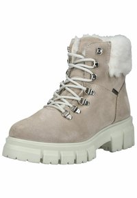 Bottines en suede beige avec col en fausse fourrure, lacets blancs et quincaillerie argentée. Semelle en caoutchouc blanche épaisse avec un motif de crampons prononcé.
