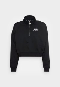 Svart kort sweatshirt med hög krage och halvdragkedja. Har meshdetaljer på axlarna och en vit "AIR"-logotyp på bröstet.