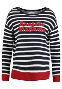 Granatowo-biały sweter w paski z czerwonymi akcentami. Na przodzie znajduje się tekst „Bonjour Madame” w czerwonym, fakturowanym haftcie. Luźny krój.