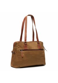 Sac en toile marron avec des accents en cuir marron, deux poignées supérieures, une poche frontale zippée et une texture douce. Forme rectangulaire, design fonctionnel.