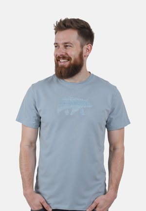 Light blue short-sleeve t-shirt with a textured bear graphic. Soft fabric, crew neckline, and relaxed fit.