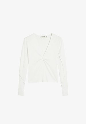 Top alb cu mâneci lungi, decolteu în V și detaliu răsucit în față. Confecționat dintr-un material reiat cu textură fină. Prezintă mâneci strânse pe braț.
