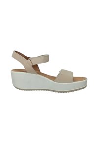 Sandali platform beige con due cinturini sul davanti e una cinghia alla caviglia regolabile, suola in gomma bianca e battistrada texturizzato.