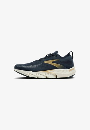 Navy blue athletic shoe with breathable mesh upper, gold accent stripe, cushioned white midsole, and black rubber outsole featuring lugs.