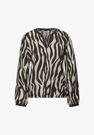 Blouse noire et crème à rayures zèbres avec des manches longues, un décolleté en V et un ourlet élastiqué. Fabriquée en tissu léger avec une texture lisse.