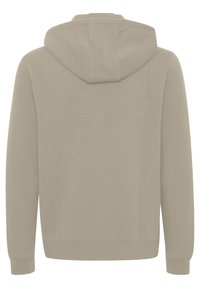 Felpa con cappuccio in beige chiaro con una texture morbida, dotata di cappuccio con coulisse, polsini e orlo a coste, che presenta un design minimalista.