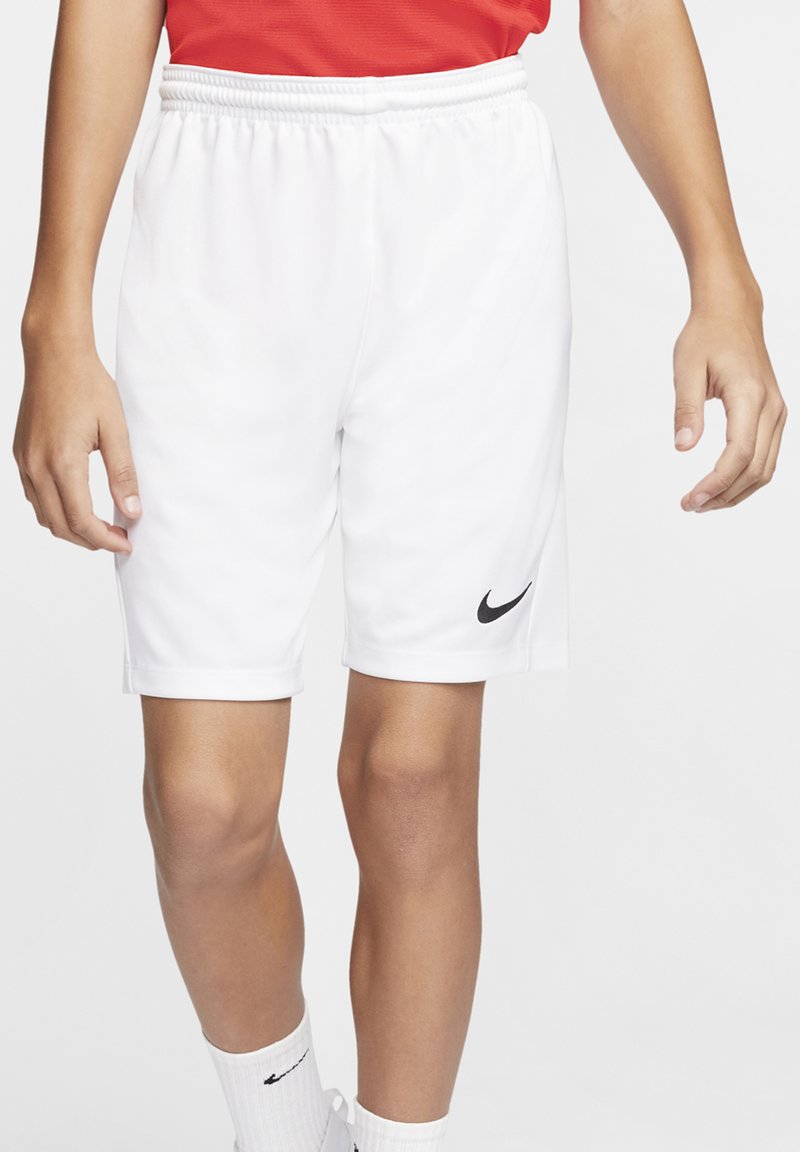 Pantalones cortos deportivos blancos con una cintura elástica, que presentan un logo negro de Nike en el muslo izquierdo. Fabricados con una tela suave y ligera.