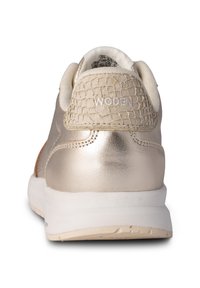 Metallic gold sneaker with textured back, white sole, and subtle branding. Features smooth material with a soft, padded collar.