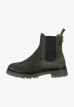 Suede Chelsea boots in dark grey with elastic side panels, pull tab, and rugged black rubber sole. Smooth texture, streamlined design.