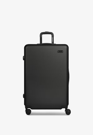 Großer schwarzer Hartschalenkoffer mit ausgezogenem Teleskopgriff, vier Spinner-Rollen und Smartbox-Logo auf der Vorderseite.