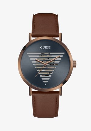 Braunlederarmbanduhr mit einem runden blauen Zifferblatt, das horizontale silberne Linien, goldene Akzente und einen transparenten Abschnitt aufweist, der die Mechanik zeigt.