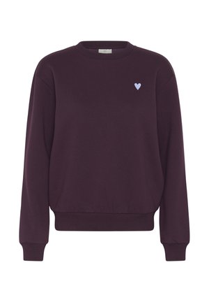 Felpa color marrone scuro realizzata in tessuto morbido, con maniche lunghe, polsini e orlo a costine, e un piccolo ricamo a forma di cuore azzurro chiaro sul petto.