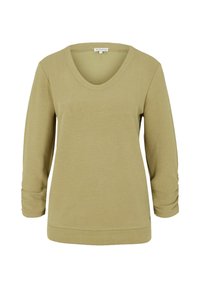 Top lungo a maniche di colore verde oliva con scollo a V, in tessuto testurizzato e con polsini arrotolati, caratterizzato da una vestibilità rilassata e dettagli di cucitura sottili.