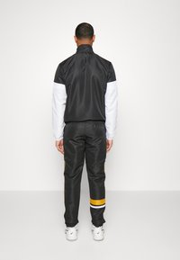 Sergio Tacchini LISTA TRACKSUIT - Survêtement - black/white/harvest gold