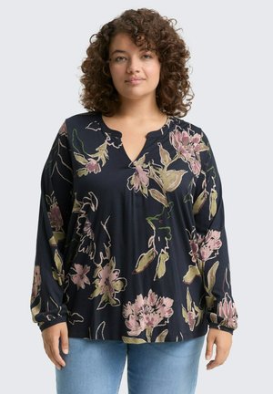 Dunkelblaue Bluse mit langen Ärmeln, V-Ausschnitt, floralen Mustern in Pink und Grün sowie einer lockeren Passform. Weicher, strukturierter Stoff.