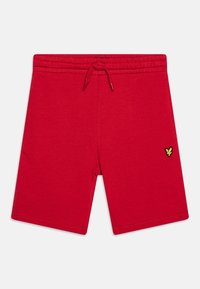 Shorts en coton rouge avec une taille élastique et un cordon de serrage. Présente un petit logo de papillon jaune au-dessus de l'ourlet sur la jambe gauche.