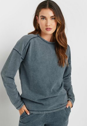 Grijze sweatshirt van zachte stof, met een ronde hals, lange mouwen en een relaxte pasvorm. Inclusief zakken en contrasterende stiksels.