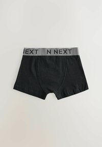 Svarta boxershorts i bomull med en grå midjeband där "N NEXT" står i svart text. Designen är enkel med en tajt passform.