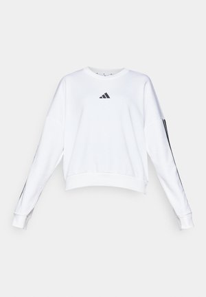 Hvit croppet hettegenser med lange ermer, som har en svart Adidas-logo på brystet og svarte side-striper på ermene. Glatt tekstur.