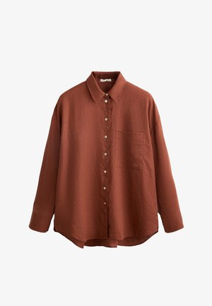 Roestkleurig overhemd met kraag, lange mouwen en een enkele zak. Gestructureerde stof en afgeronde onderkant.