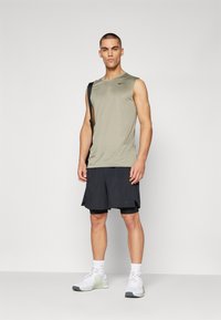 Nike Performance TEE RESET - Top - light army/black