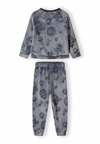 Grey fleece pajama set featuring a long-sleeve top with a round neckline and patterned bottoms. Patterns include stars and various shapes.