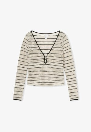 Maglietta a maniche lunghe color crema con strisce orizzontali nere. Presenta un profondo scollo a V e un design cropped. Realizzata in tessuto testurizzato con un motivo a strati.