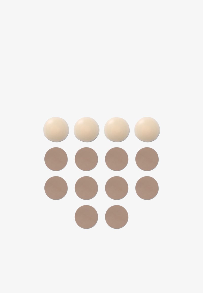 Set di cuscinetti circolari in silicone: tre sfere color crema e otto cerchi color beige, superficie liscia, dimensioni uniformi, disposti in righe.