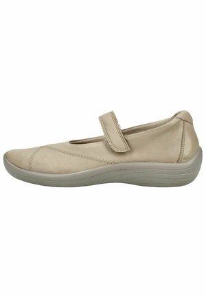Beige Mary Jane flat shoe with adjustable strap and cushioned sole for comfort and support.