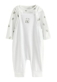 Weißer Overall mit langärmligem Oberteil, versehen mit einem Bärenmotiv und kleinen Bärenmustern. Weicher Stoff, Knopfverschluss und gerippte Bündchen.