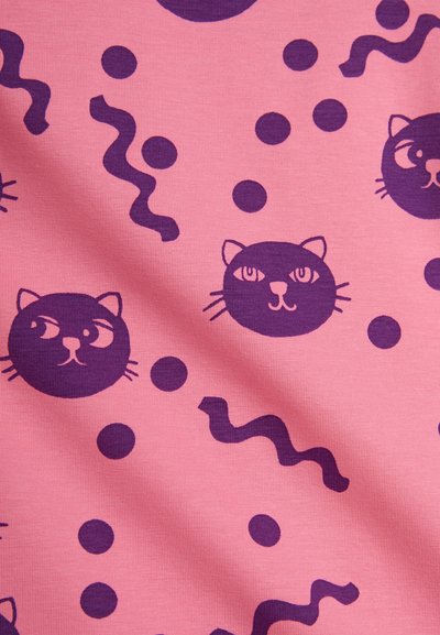 Pink fabric features a pattern of dark purple cat faces, circles, and wavy lines, with a smooth texture and matte finish.