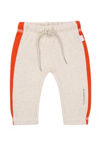 Helle beige Jogginghose mit orangenen Seitenstreifen, elastischem Bund und Kordelzug. Weiche Textur, figurnah geschnitten, mit einem kleinen Logodetail.