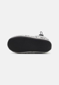 Gray patterned slipper showing a textured upper, black rubber sole with grooves, and a small loop at the back for easy wear.