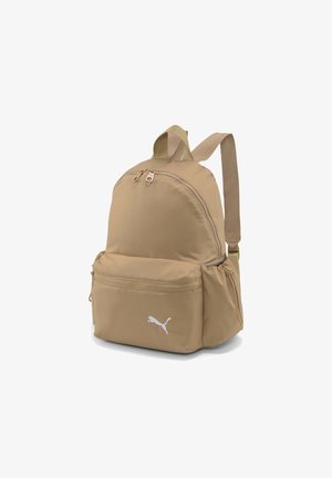 Sac à dos beige Puma avec poche avant zippée, poches latérales, bretelles doubles et logo Puma sur la poche avant inférieure.