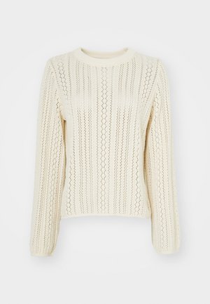 Kermitoyhteinen neulepaita, jossa on teksturoitu malli, joka koostuu pystysuorista raidoista ja läpikuultavasta koostumuksesta; pitkät hihat ja pyöreä pääntie.