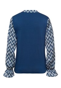 Marineblauwe top met een effen body en mouwpatroon in zigzagprint. Lange, losse mouwen met gathered cuffs. Zachte, lichte stof.
