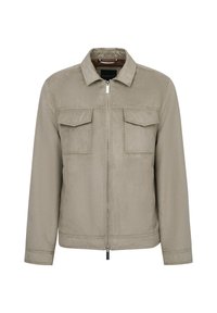 Beige zip-up jacket with a collar, two chest pockets, and a smooth, matte texture. Features minimalistic design and subtle stitching details.