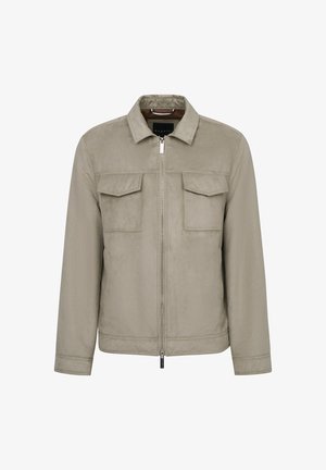 Beige Zip-Jacke mit Kragen, zwei Taschen auf der Brust und einer glatten, matten Textur. Verfügt über ein minimalistisches Design und dezente Nähte.