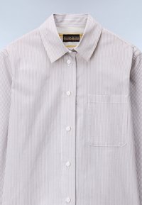 Striped button-up shirt with a light beige and gray pattern, made from smooth fabric. Features a pointed collar and a chest pocket.