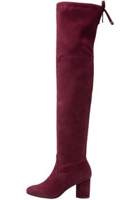 Botas burdeos por encima de la rodilla, hechas de suave ante, que cuentan con un tacón cuadrado, una silueta alta y un borde fruncido con detalle de lazo.