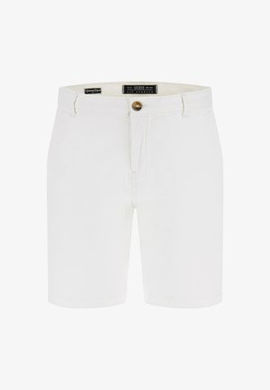 Valged denimpüksid, millel on nuppude sulgemine, vöökonksud ja eesmitmed taskud. Sile tekstuur puhta õmbluse ja hästi istuva lõikega.