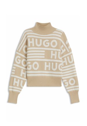 Beige striktrøje med høj hals, prydet med cremefarvede vandrette striber og "HUGO" gentaget i store blokbogstaver. Strikket tekstur, afslappet pasform.